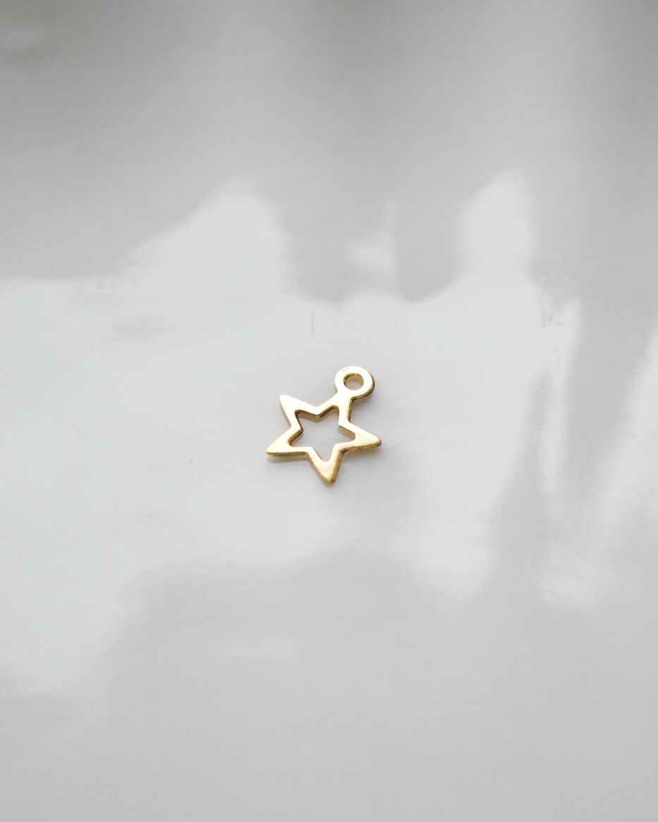 Dije de Estrella Bañado en Oro