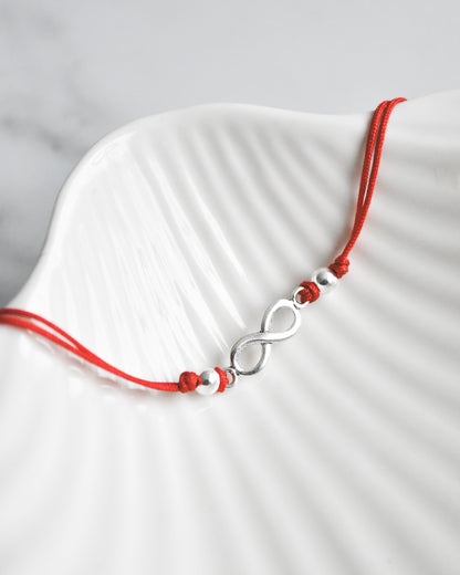 Pulsera Amuleto Infinito de Hilo Rojo y Plata 925 – Conexión, Amor y Energía sin Límites