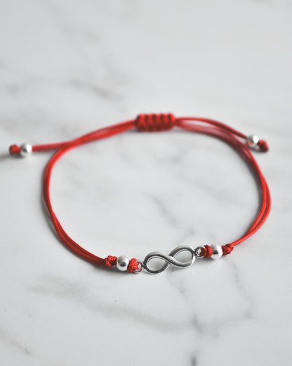 Pulsera Amuleto Infinito de Hilo Rojo y Plata 925 – Conexión, Amor y Energía sin Límites